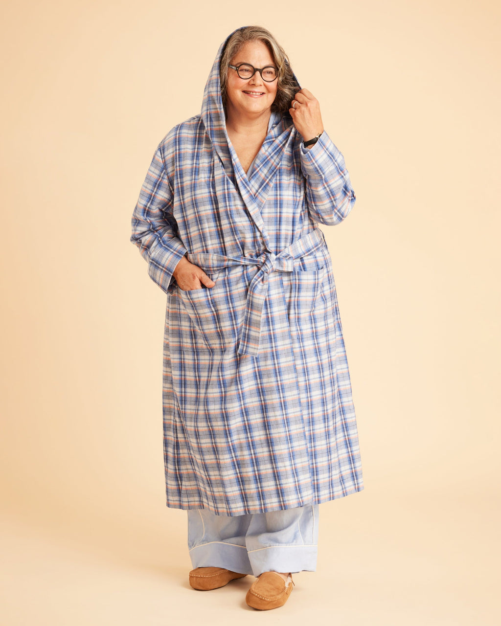Person wearing a blue plaid robe on a beige background. This is the Fiske Sleepwear Set sewing pattern from Cashmerette.